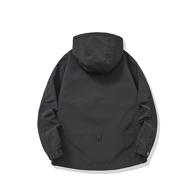 Back view of an Oversized Hooded Cargo Jacket in solid black, highlighting its casual design and roomy fit.